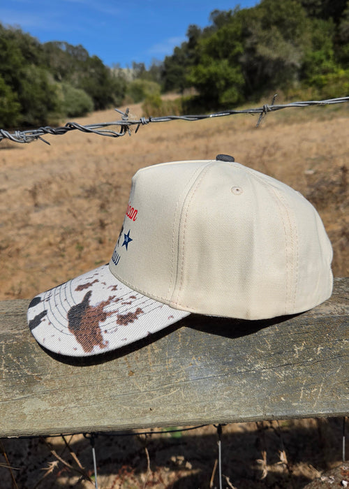 American Outlaw- Cow-print Trucker Hat